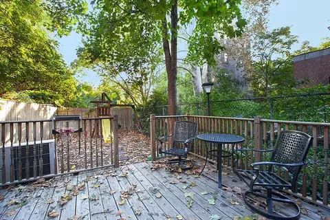 a view of a wooden deck with furniture