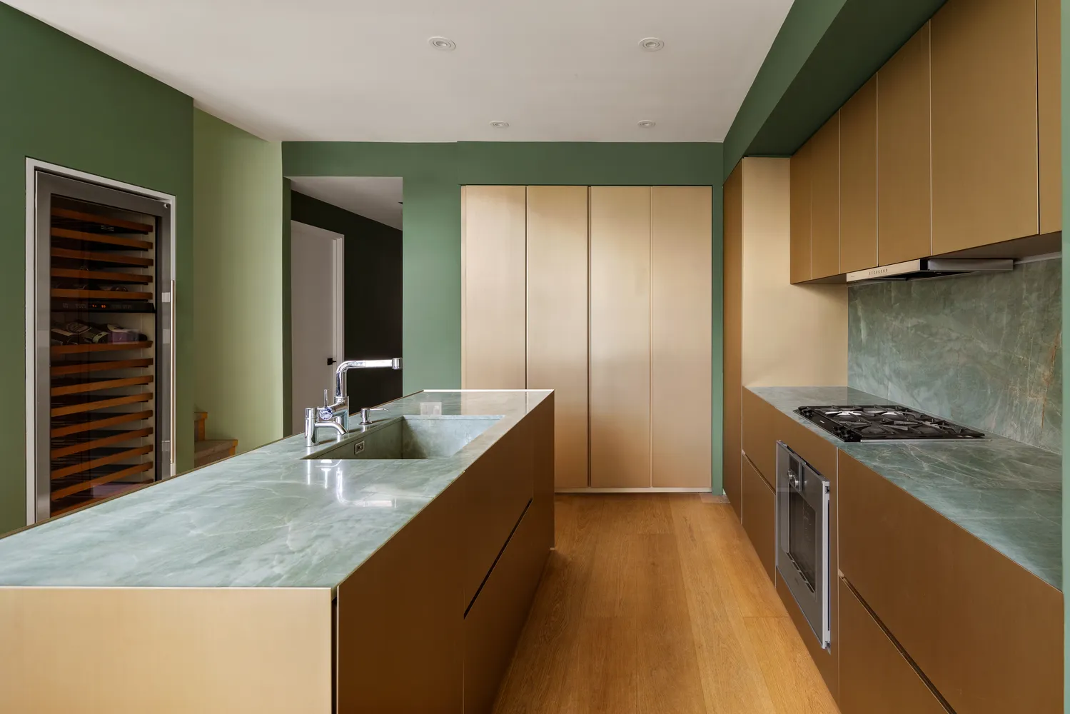 a kitchen with granite countertop a sink and a stove top oven