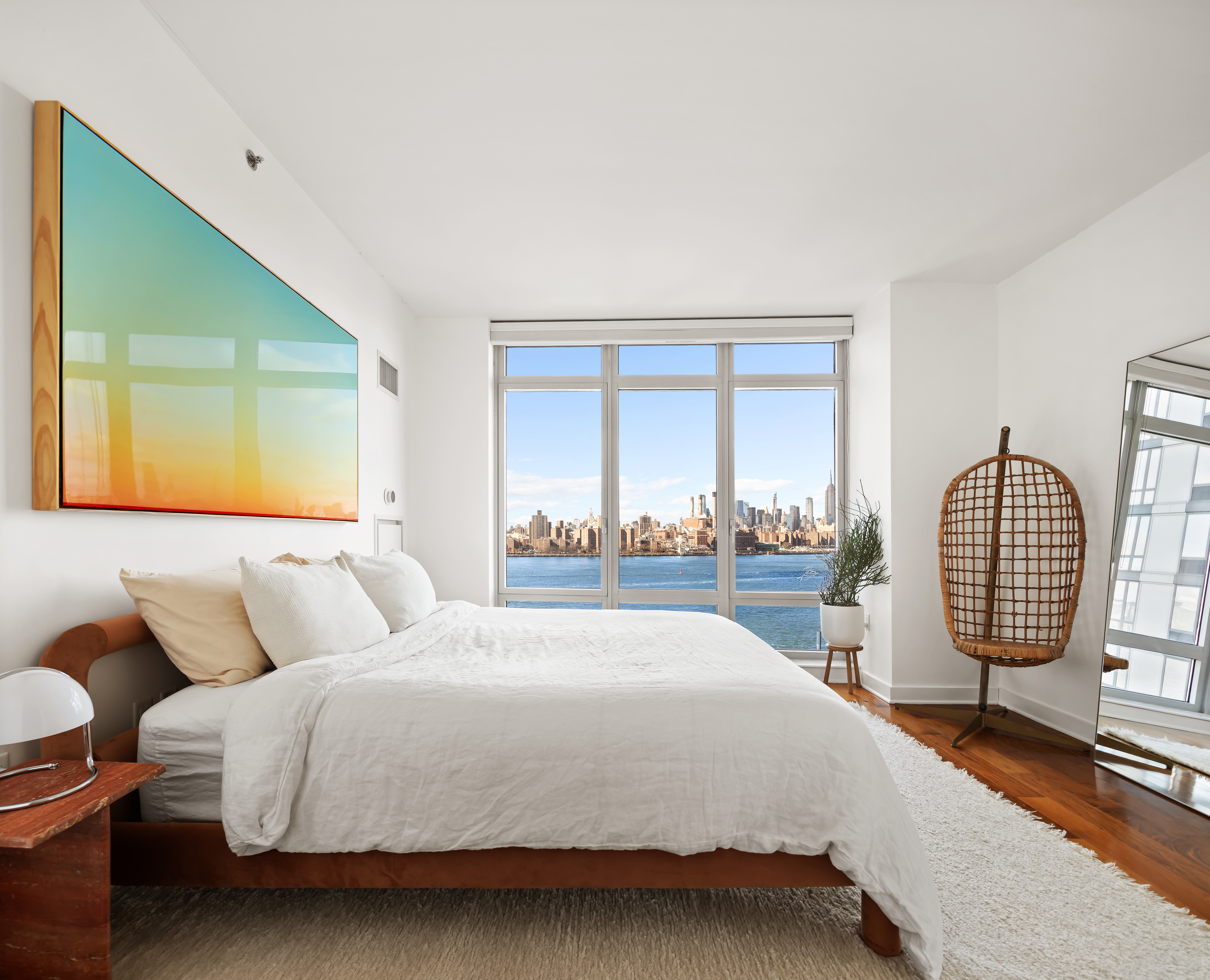 2 Northside Piers, Unit 8A Brooklyn, NY 11249 - Photo 5 of 11 a bedroom with a bed chair and a large window