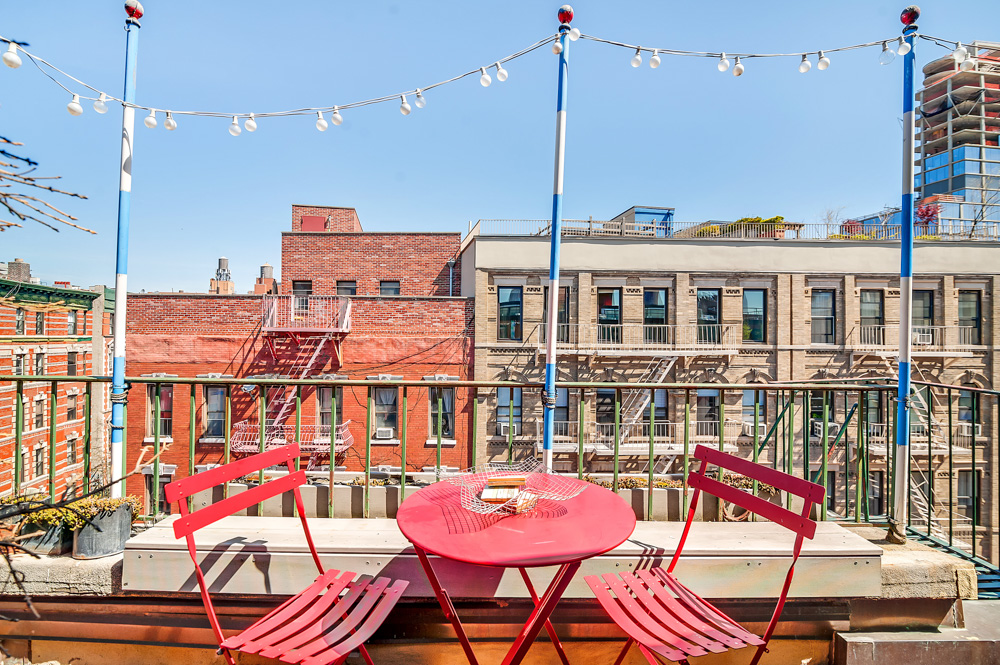 a patio with water view and city view