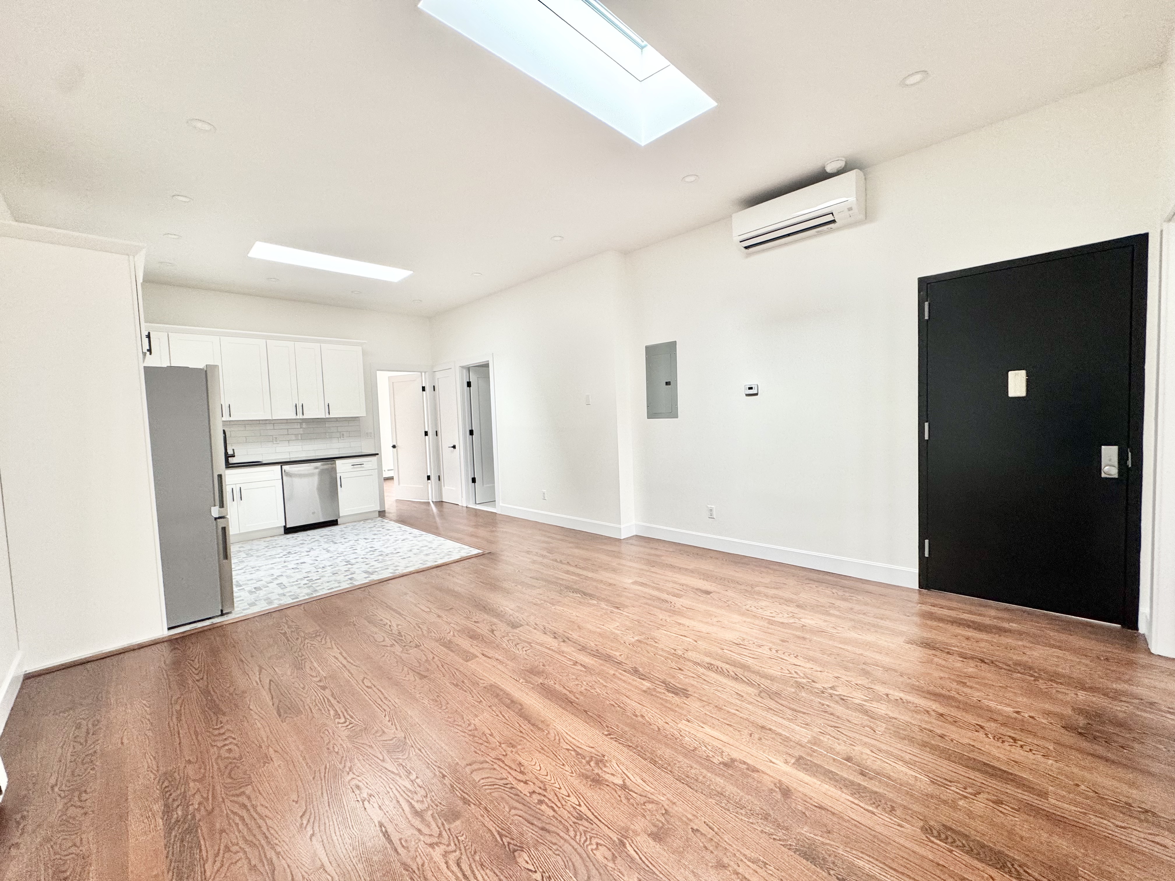 383 Myrtle Avenue, Unit 3 Brooklyn, NY 11205 - Photo 20 of 21 a view of a kitchen with wooden floor and a refrigerator