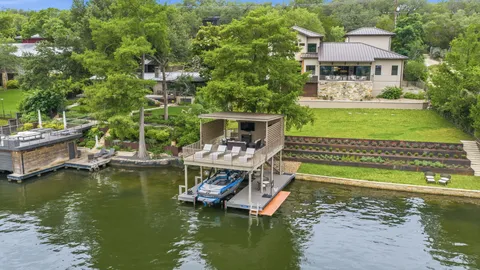 an aerial view of a house with a yard and garden