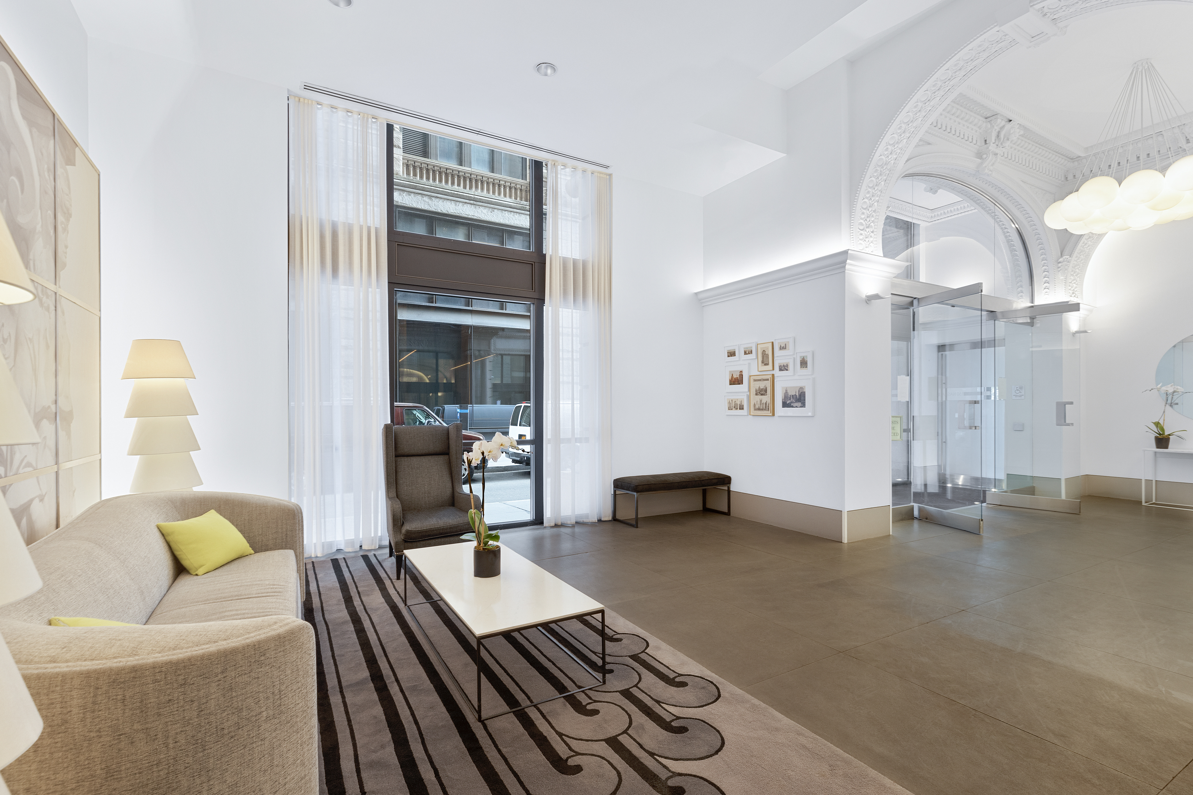 150 Nassau Street, Unit 17D Manhattan, NY 10038 - Photo 14 of 16 a living room with furniture