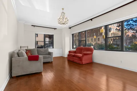 a living room with furniture or couch and a large window