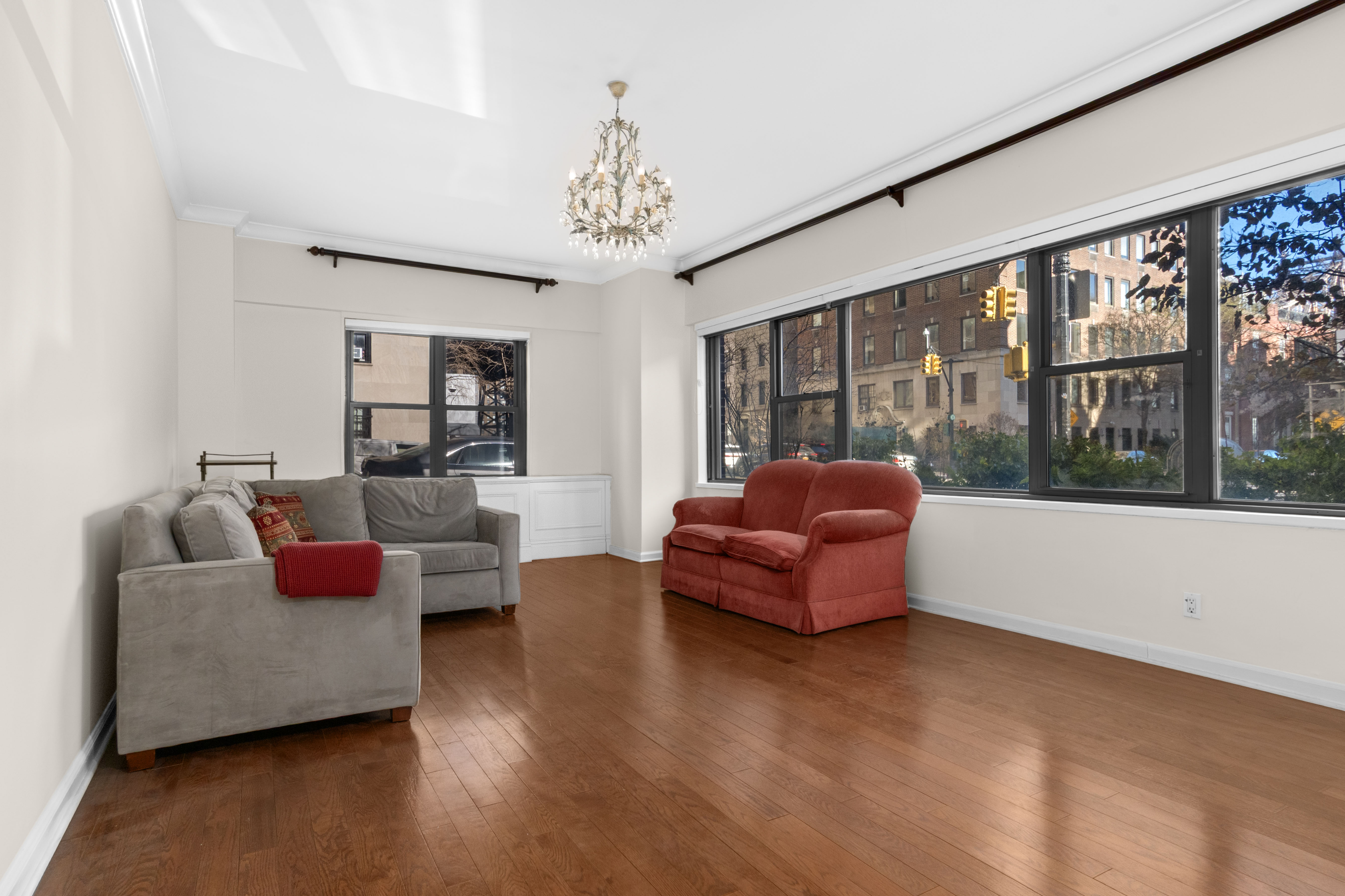 16 Sutton Place, Unit 1A/1B Manhattan, NY 10022 - Photo 2 of 25 a living room with furniture or couch and a large window