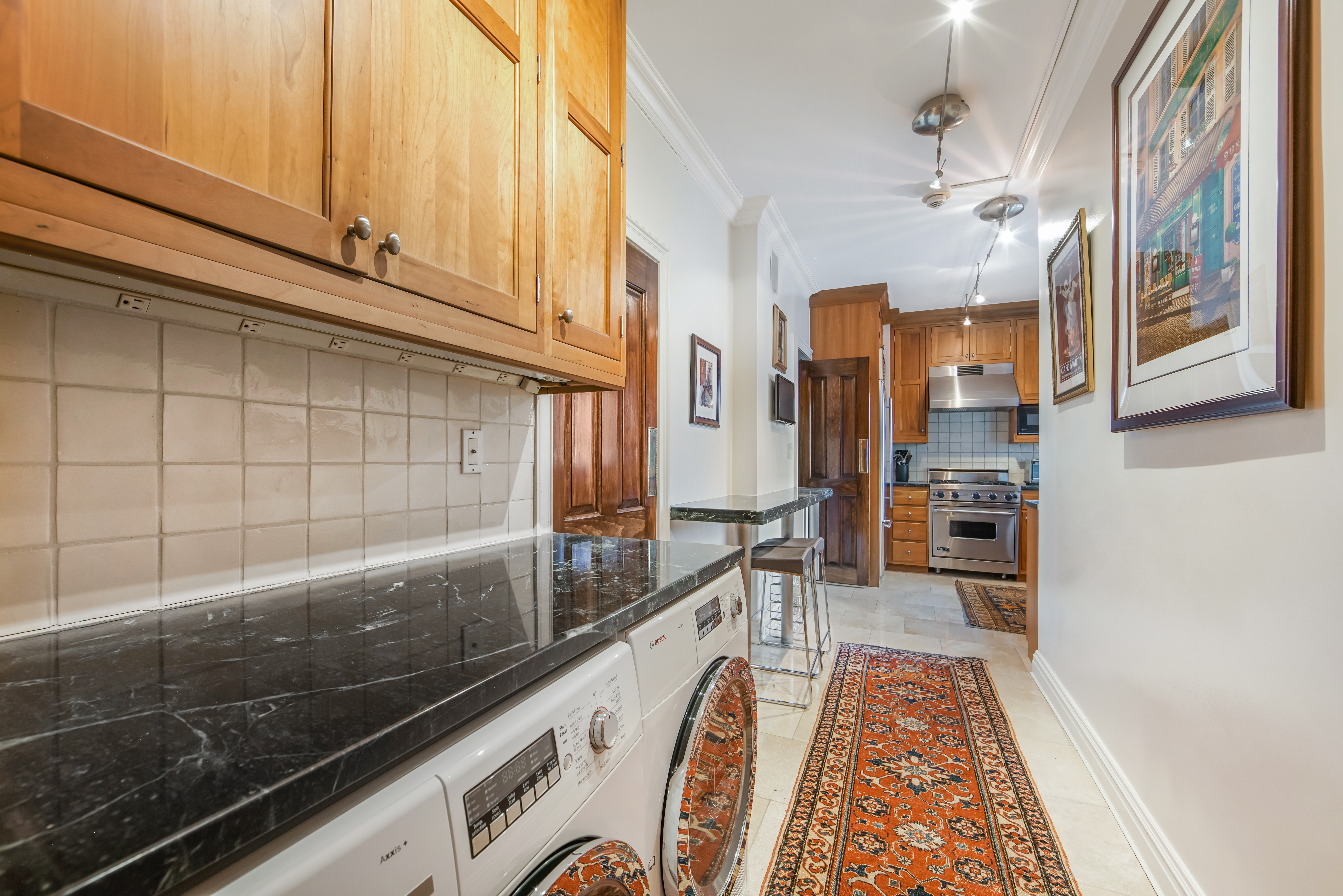 425 East 58th Street, Unit 29C Manhattan, NY 10022 - Photo 6 of 9 a view of a kitchen with a sink and cabinets