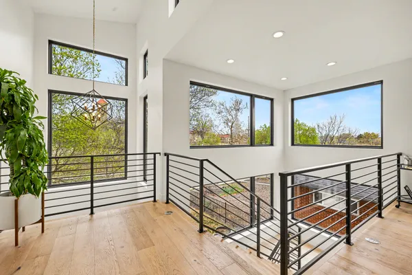 a view of an entryway with wooden floor