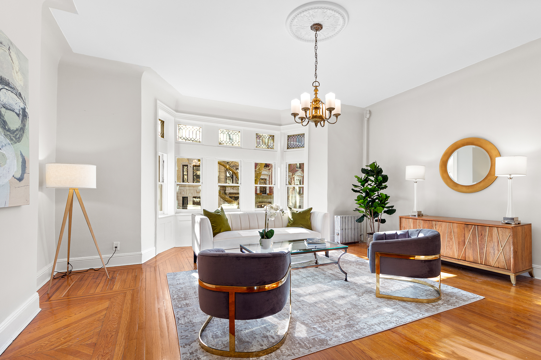 579 5th Street Brooklyn, NY 11215 - Photo 1 of 19 a living room with furniture and a chandelier