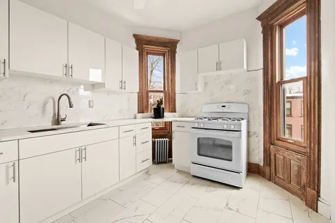 a bathroom with a bathtub a shower and a sink