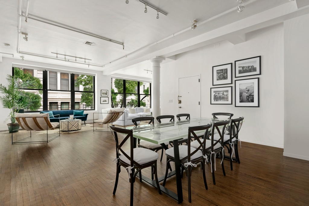 120 West 18th Street, Unit 2A Manhattan, NY 10011 - Photo 4 of 14 a view of a dining room with furniture window and wooden floor