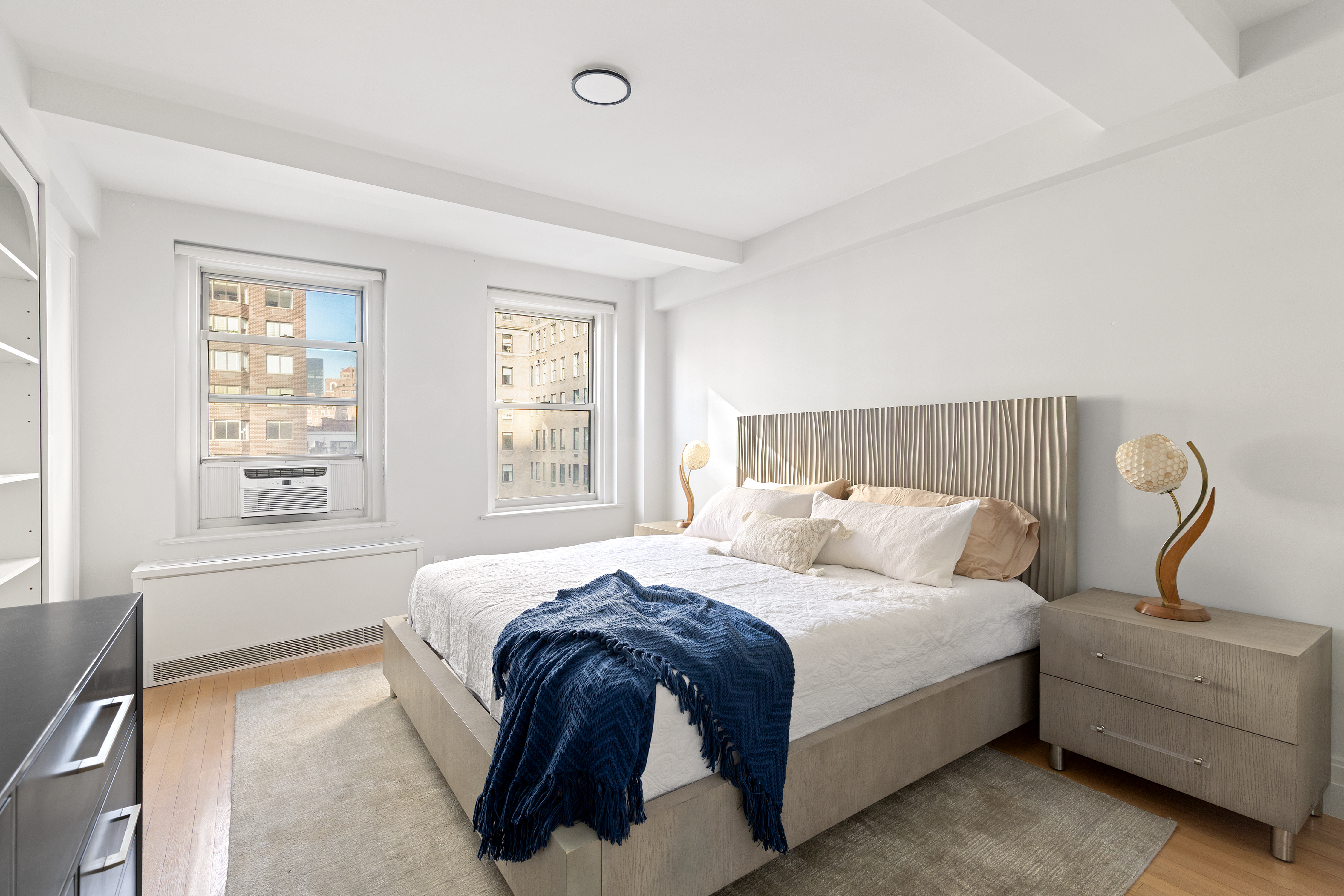 434 East 52nd Street, Unit 10E Manhattan, NY 10022 - Photo 6 of 13 a bedroom with bed and window