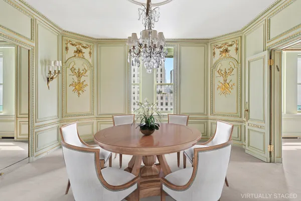 a dining room with furniture and window