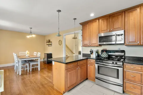 a kitchen with a sink cabinets and window