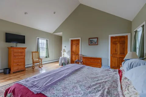 an aerial view of residential houses with outdoor space and street view