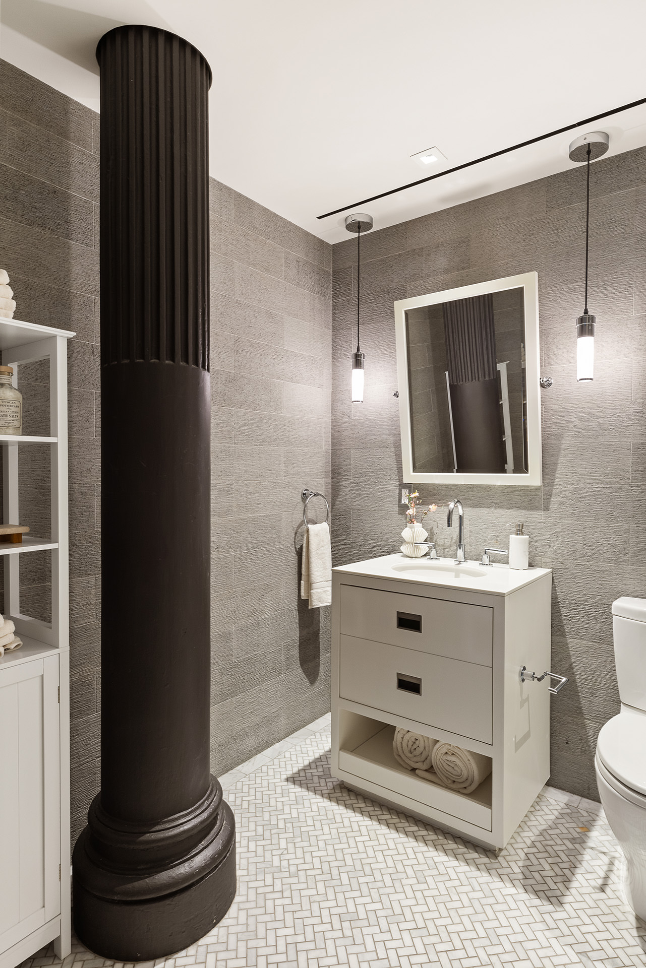 56 Crosby Street, Unit 2A Manhattan, NY 10012 - Photo 19 of 21 a bathroom with a sink toilet and mirror