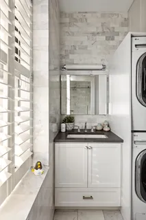 a bathroom with a sink and a washing machine