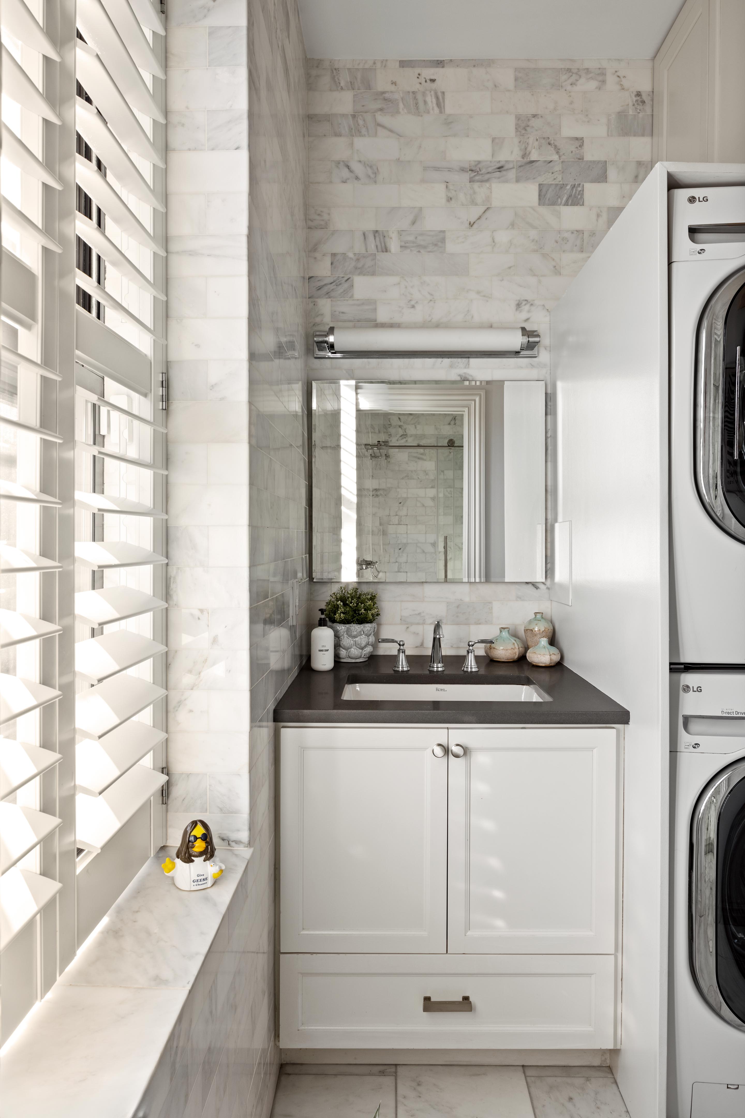 209 Clinton Street, Unit 4L Brooklyn, NY 11201 - Photo 9 of 17 a bathroom with a sink and a washing machine