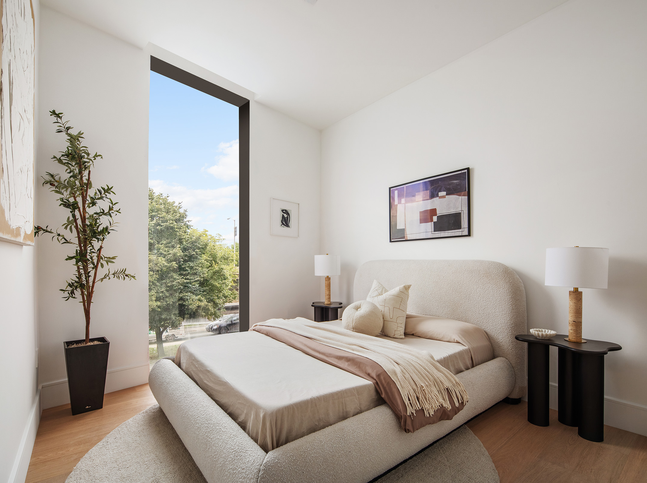 28 Herbert Street, Unit 2E Brooklyn, NY 11222 - Photo 2 of 3 a bedroom with a large bed and a potted plant