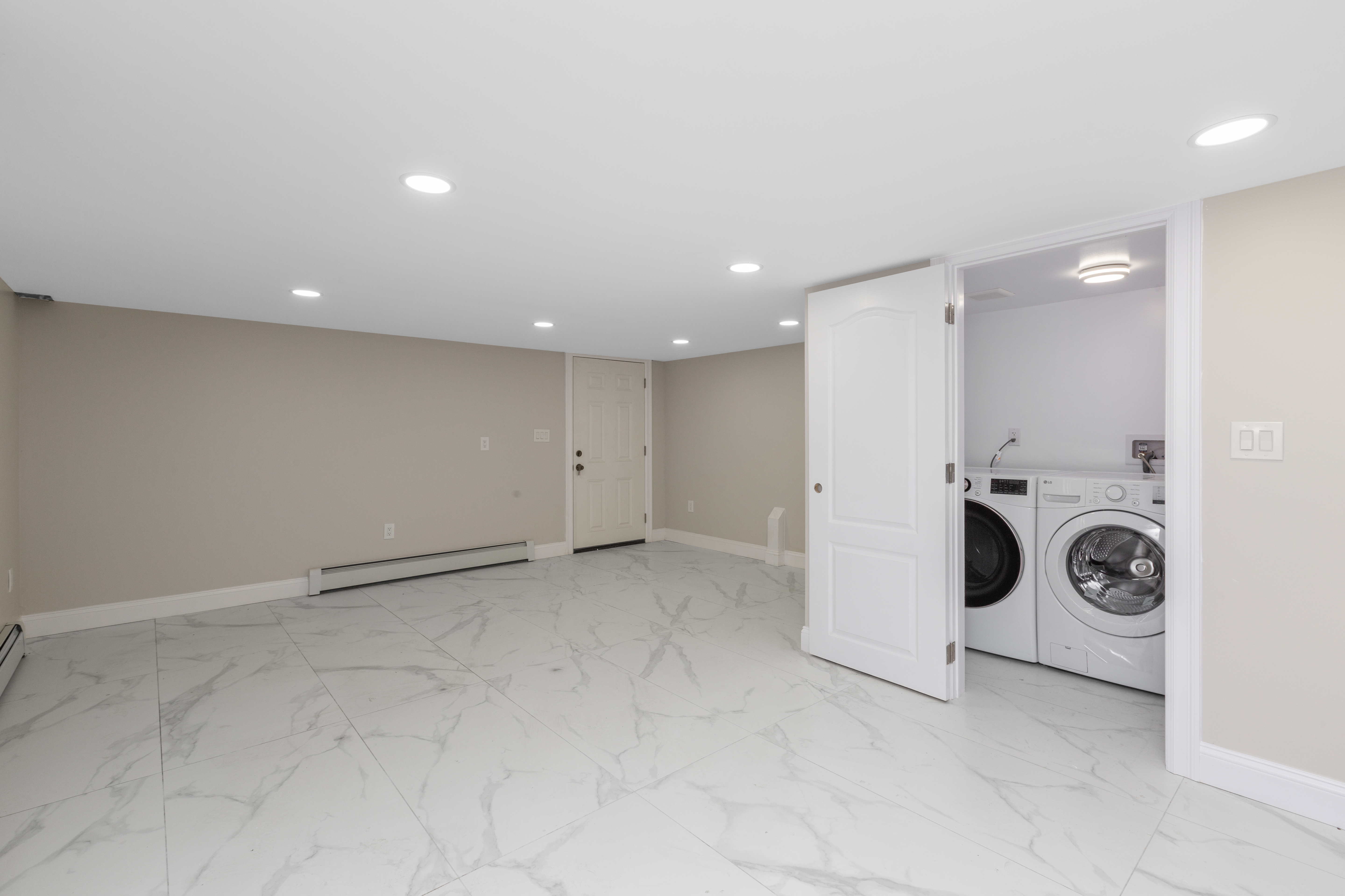 143-10 Shore Avenue Queens, NY 11435 - Photo 22 of 30 a view of a storage & utility room with washer and dryer