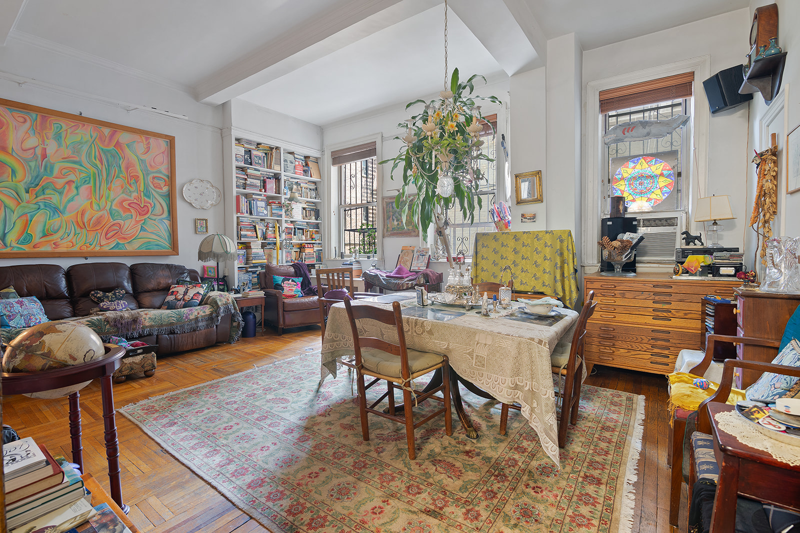 41 Eastern Parkway, Unit 1D Brooklyn, NY 11238 - Photo 4 of 16 a living room with furniture a rug and a potted plant