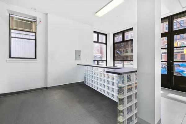 a bedroom with furniture and window