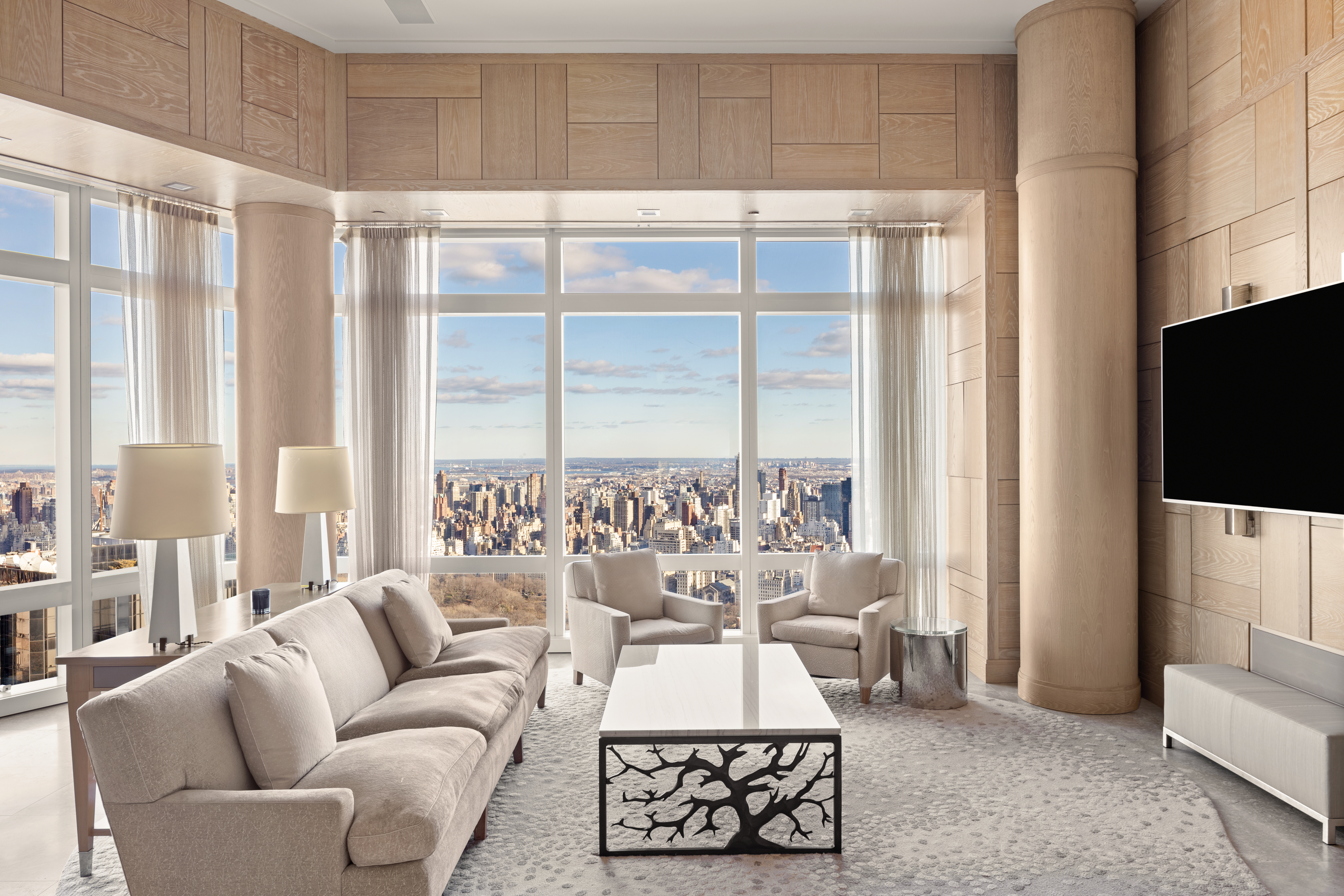 25 Columbus Circle, Unit 75A Manhattan, NY 10019 - Photo 3 of 36 a living room with furniture and a flat screen tv