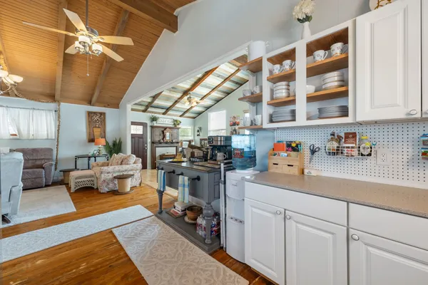 a kitchen with sink and cabinets