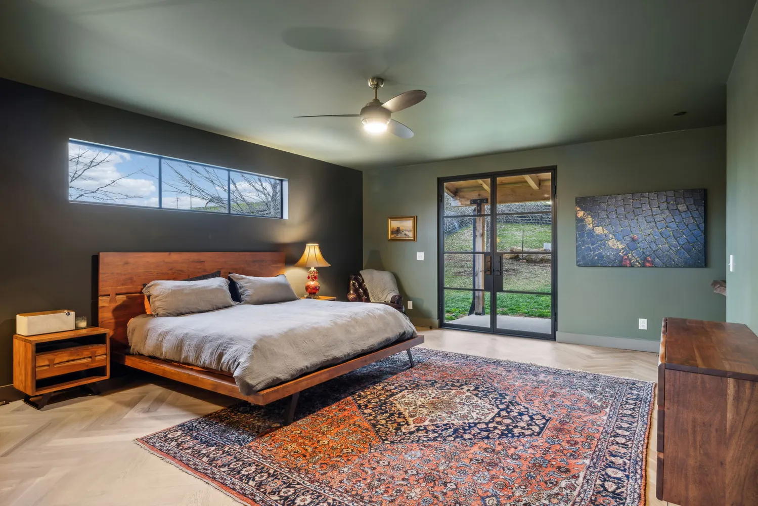 a bedroom with a large bed and a window