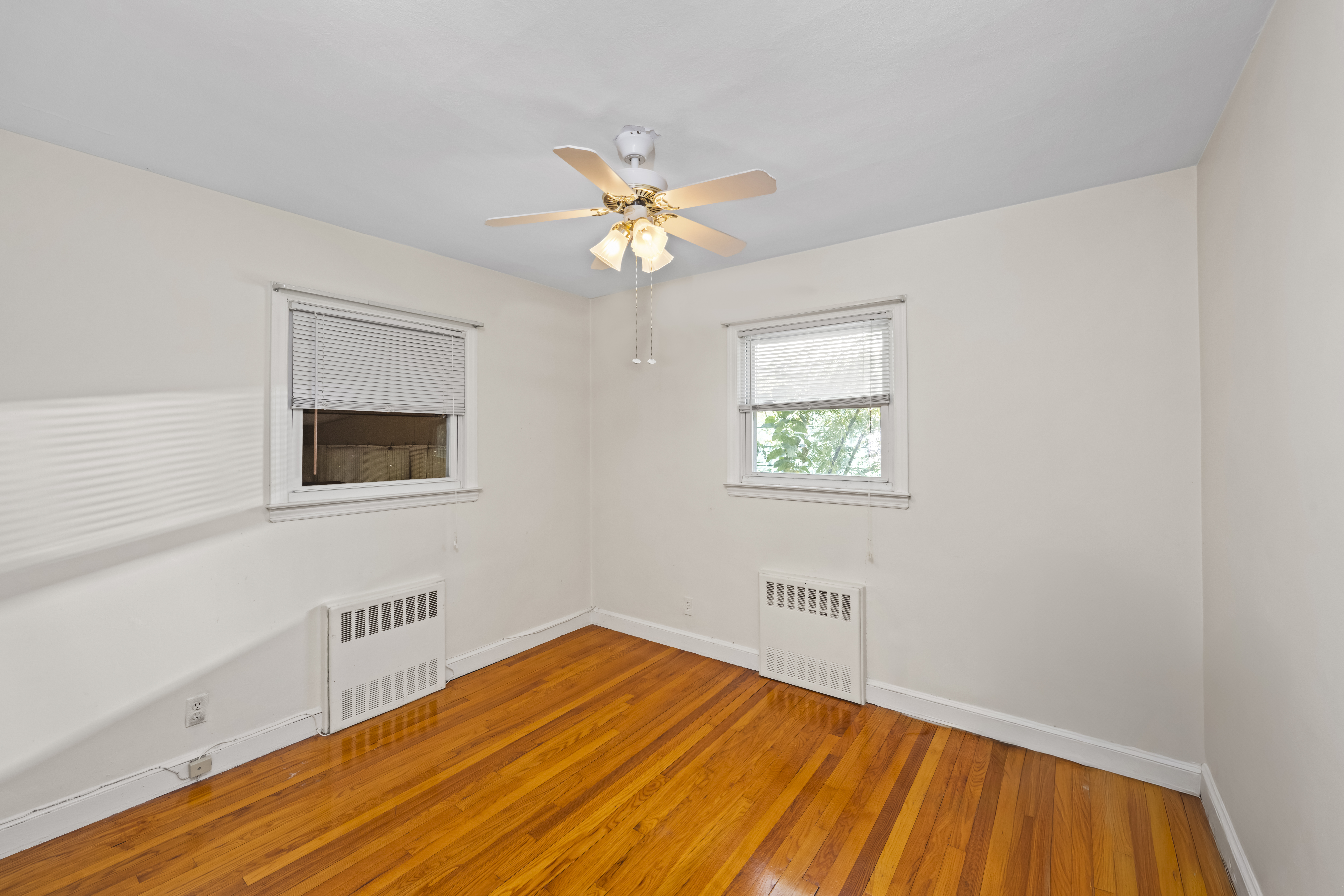 522 Stewart Avenue Staten Island, NY 10314 - Photo 18 of 33 a view of empty room with a window and wooden floor