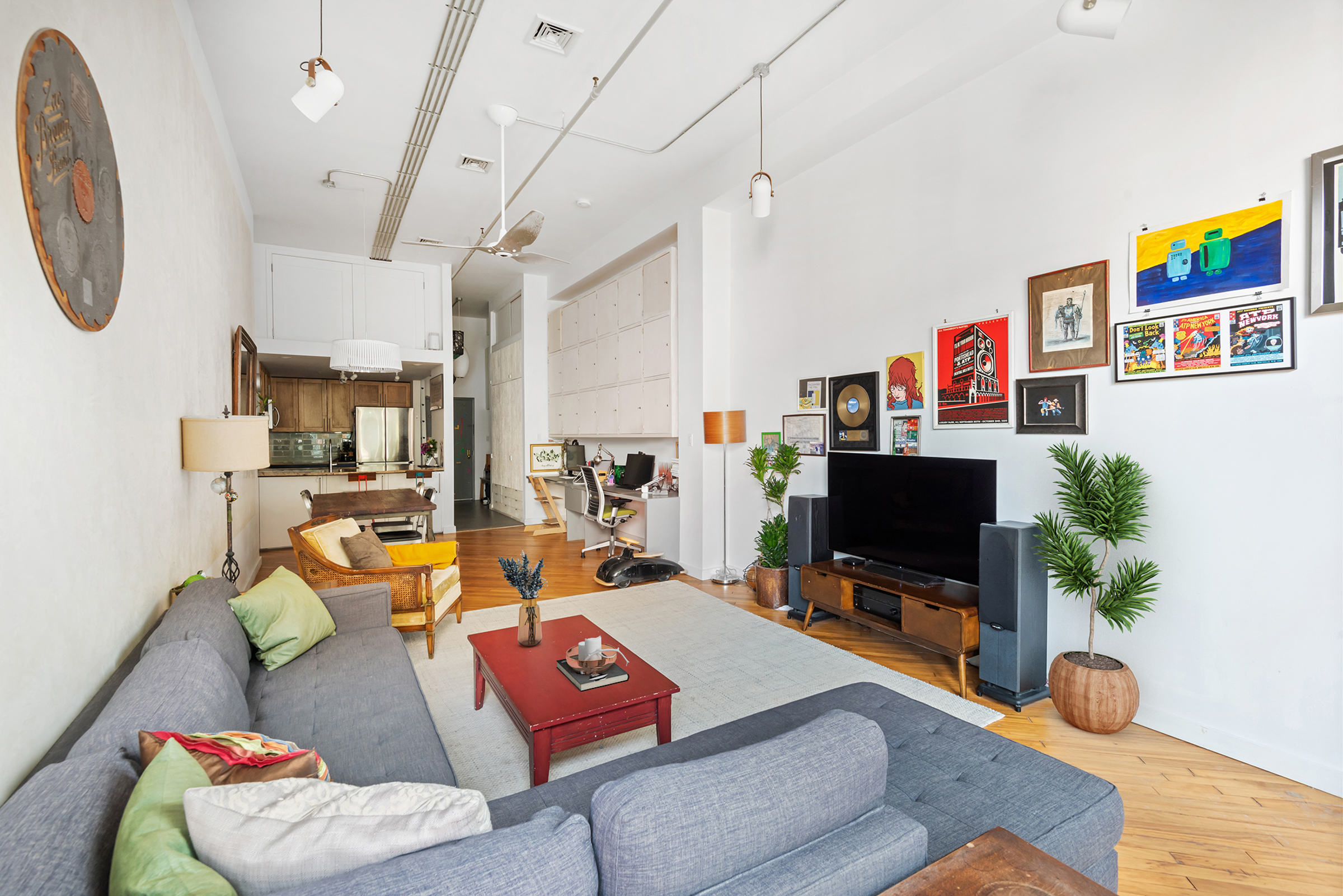 105 Lexington Avenue, Unit 2G Brooklyn, NY 11238 - Photo 9 of 17 a living room with furniture and a flat screen tv