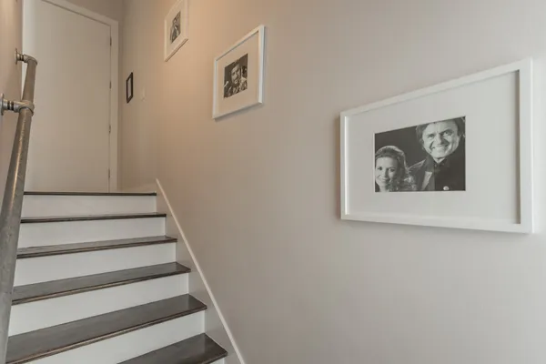 a view of staircase with white walls and a window