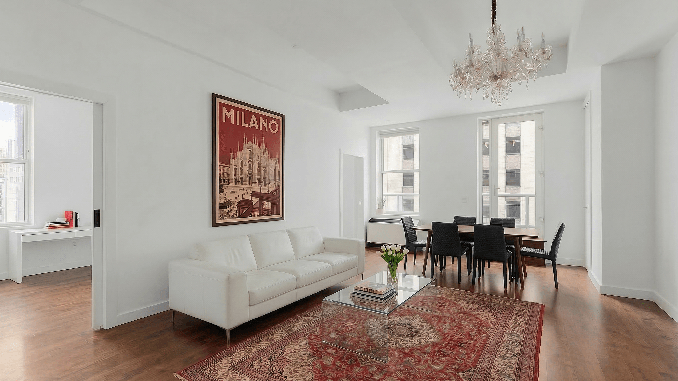 15 Broad Street, Unit 2300 Manhattan, NY 10005 - Photo 1 of 36 a living room with furniture and wooden floor