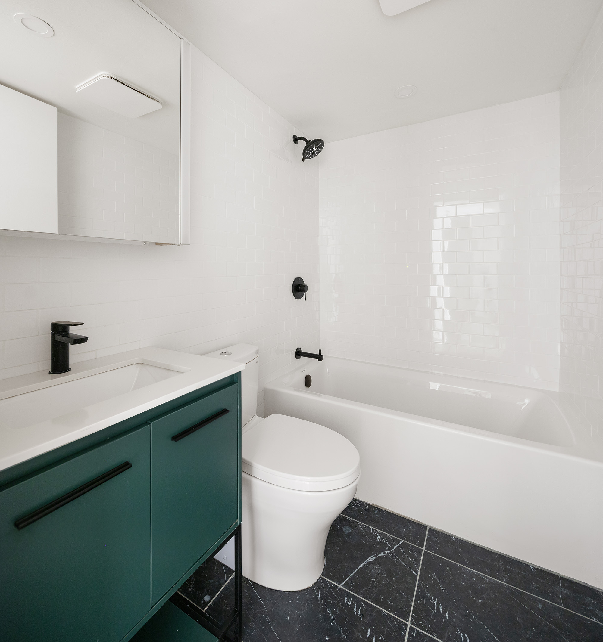 306 Gates Avenue, Unit 1A Brooklyn, NY 11216 - Photo 10 of 14 a bathroom with a sink a toilet and a bathtub