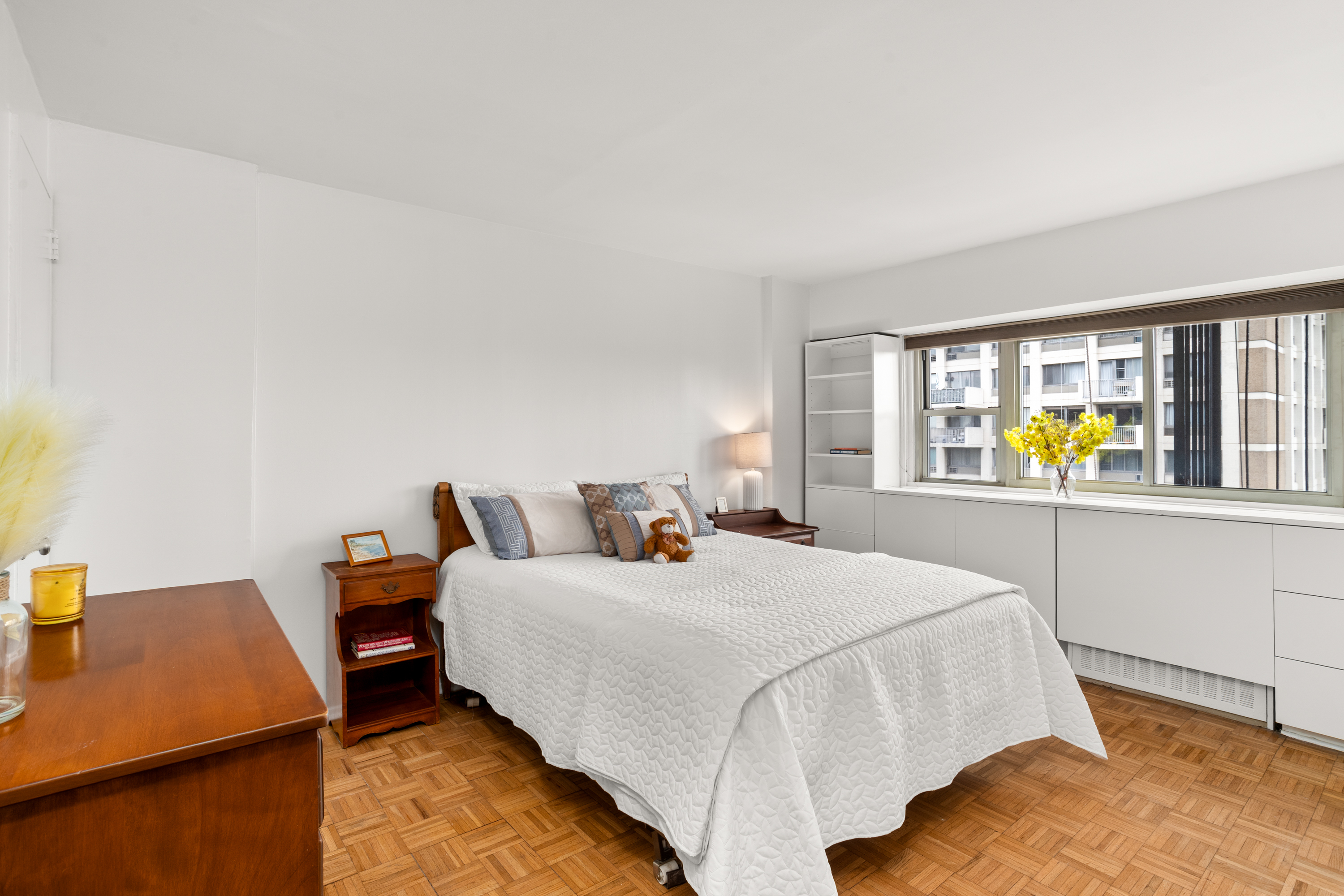 609 Columbus Avenue, Unit 14E Manhattan, NY 10024 - Photo 16 of 24 a bedroom with a bed and wooden floor