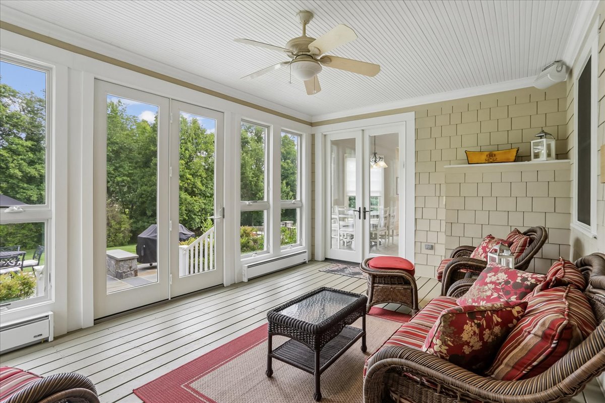 11736 Gainsborough Road Potomac, MD 20854 - Photo 44 of 90 a living room with furniture and floor to ceiling windows