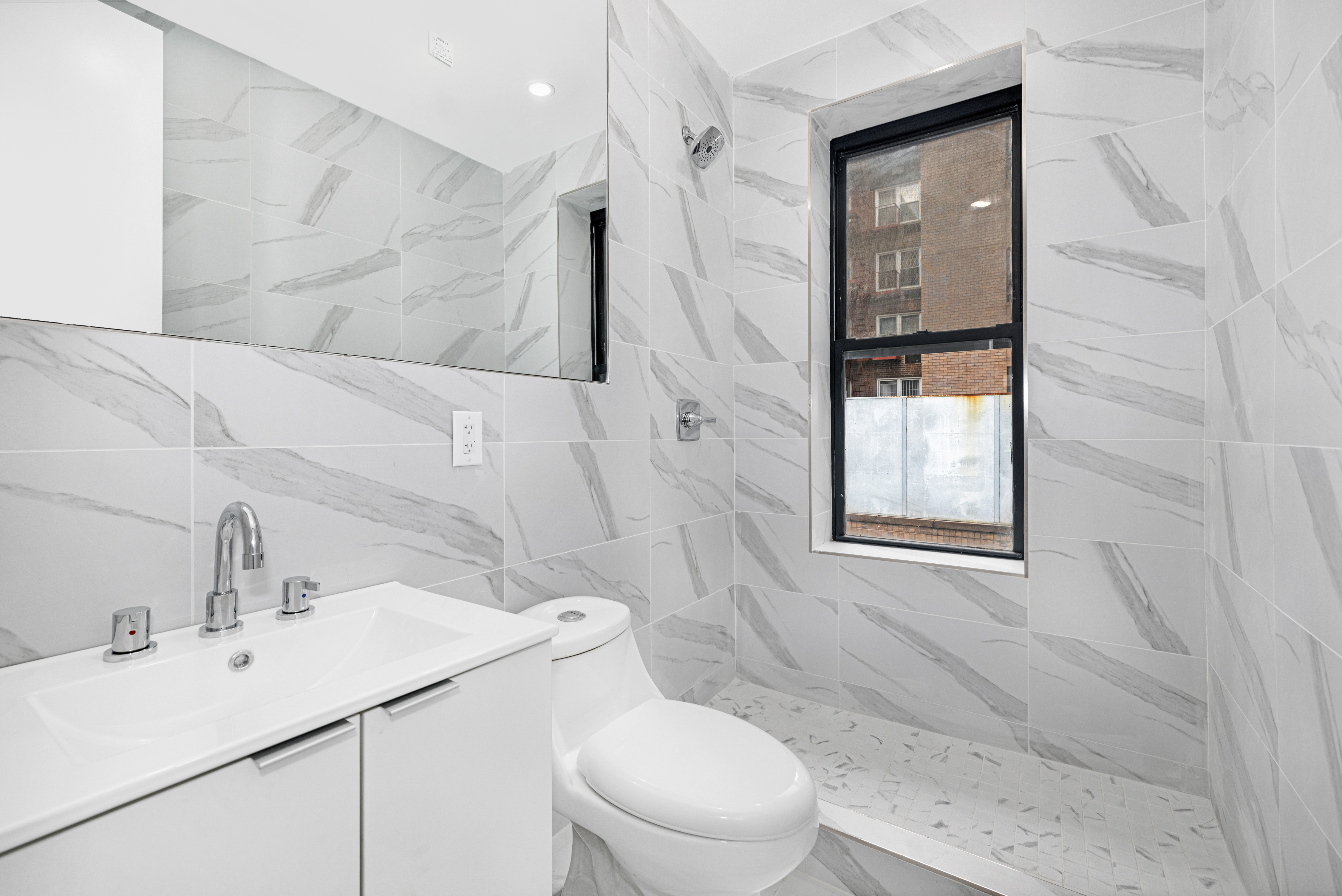 640 Ditmas Avenue, Unit 23 Brooklyn, NY 11218 - Photo 6 of 9 a bathroom with a sink toilet and shower