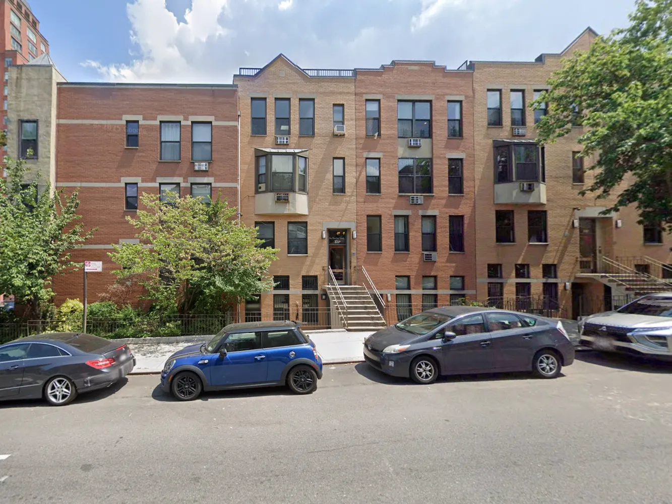 a view of a cars parked in front of a building