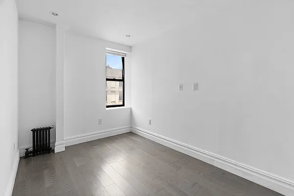 20 Avenue A, Unit 3AB Manhattan, NY 10009 - Photo 4 of 13 an empty room with windows