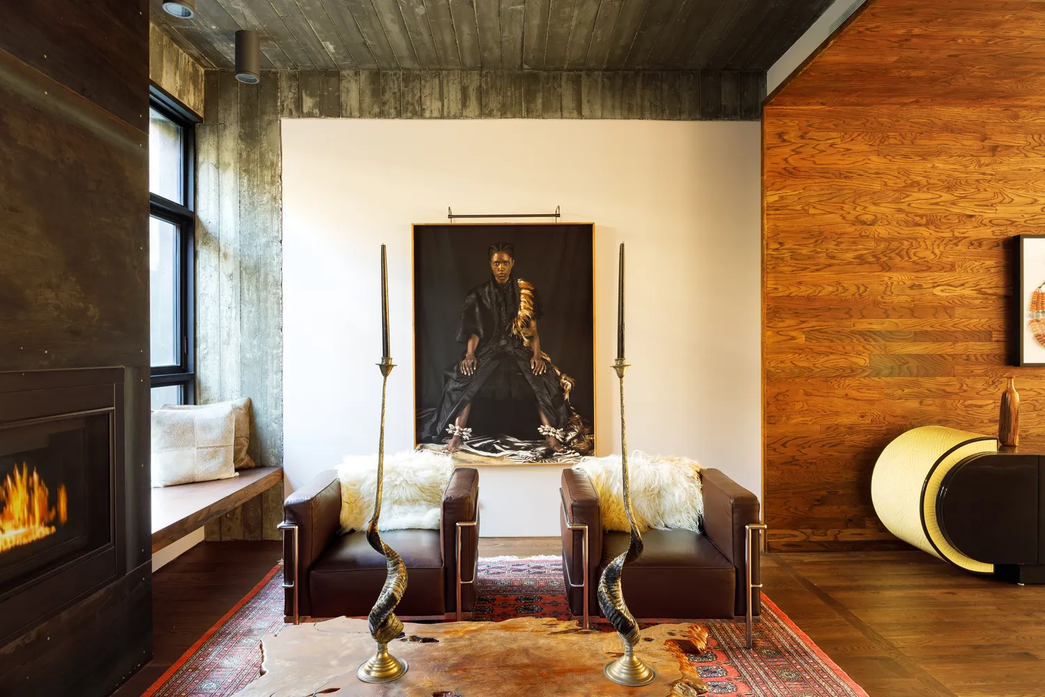 a living room with fireplace furniture and a wooden floor