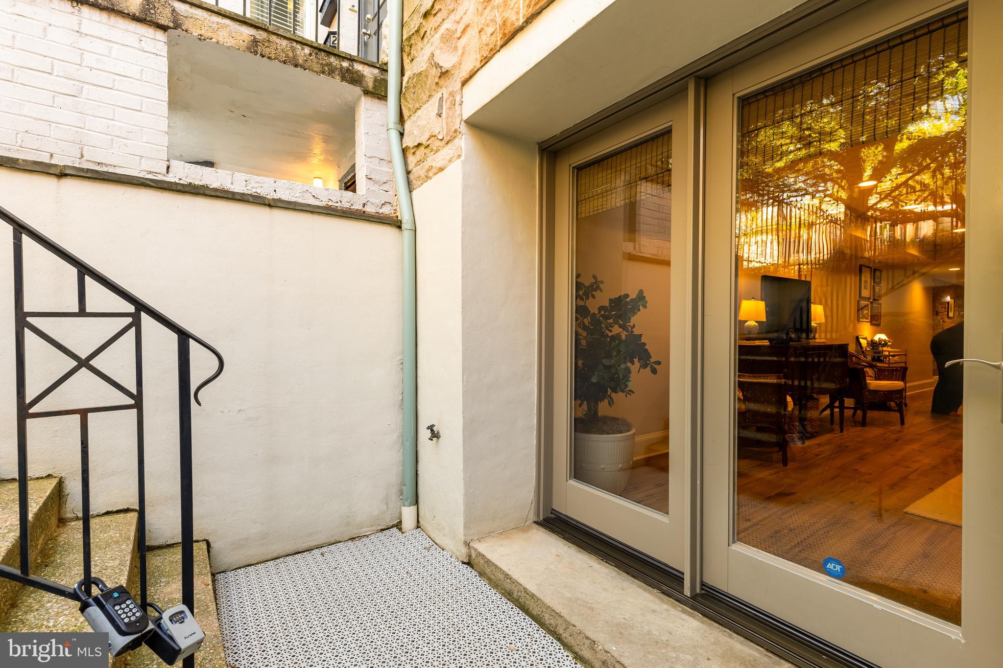 1354 Kenyon Street Northwest, Unit G Washington, DC 20010 - Photo 4 of 37 a view of a room with a door and porch