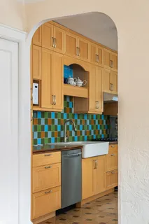 a kitchen with stainless steel appliances granite countertop a stove and cabinets