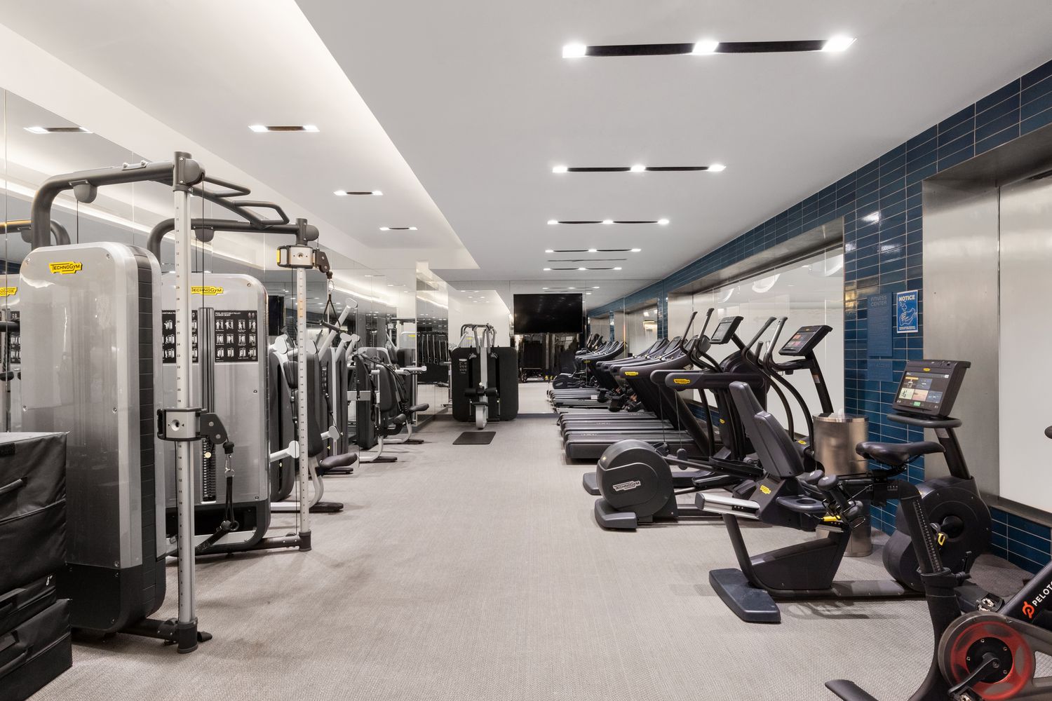 70 Charlton Street, Unit 19D Manhattan, NY 10014 - Photo 13 of 14 a view of a room with gym equipment