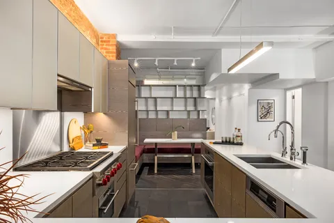 a kitchen with a stove and a sink