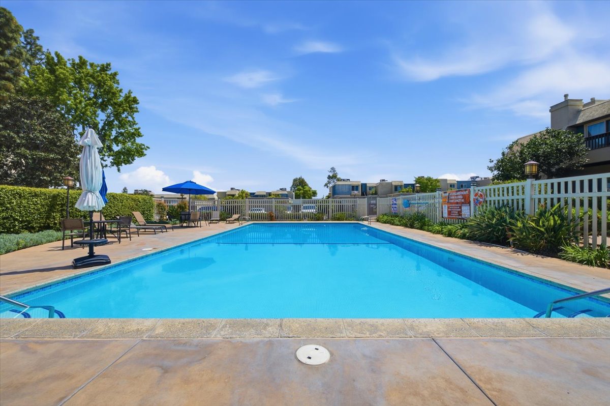 6373 Rancho Mission Road, Unit 5 San Diego, CA 92108 - Photo 7 of 30 a view of a swimming pool and lounge chairs