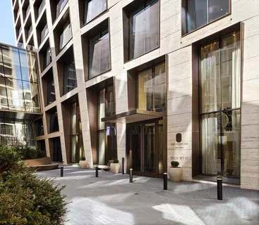 a picture of a wall with a white building