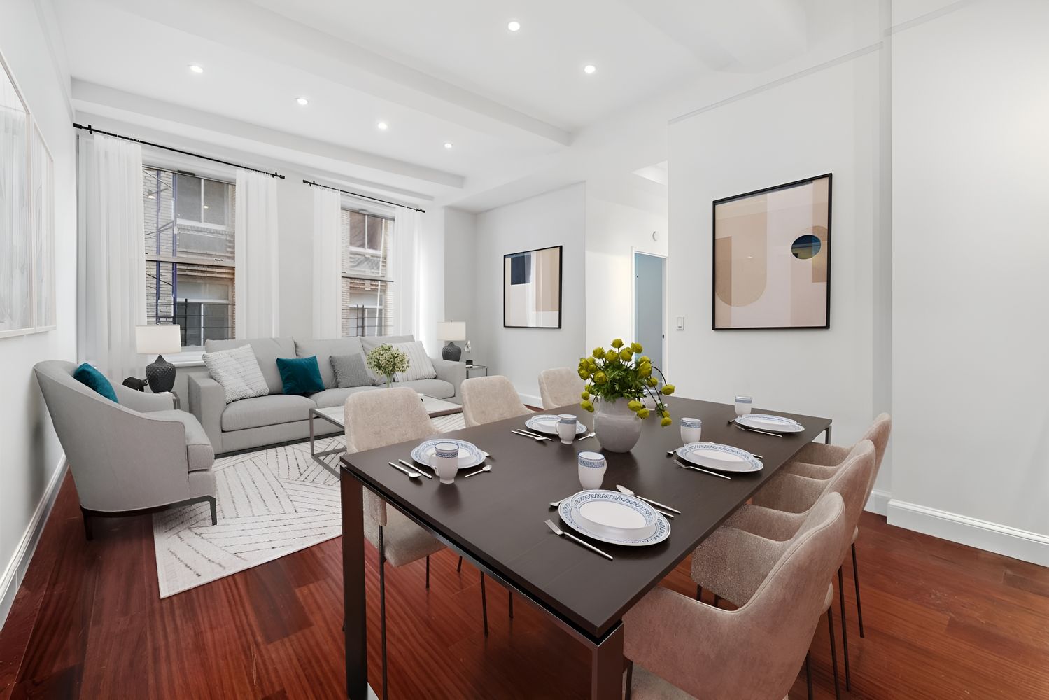 a view of a dining room with furniture and wooden floor