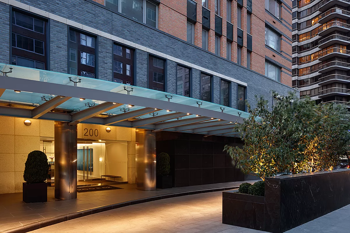 200 East 62nd Street, Unit 10C Manhattan, NY 10065 - Photo 16 of 21 a view of a building with a bench