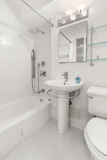 a bathroom with a sink toilet and bathtub