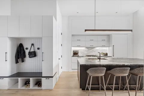 a kitchen with stainless steel appliances granite countertop a stove a refrigerator and cabinets