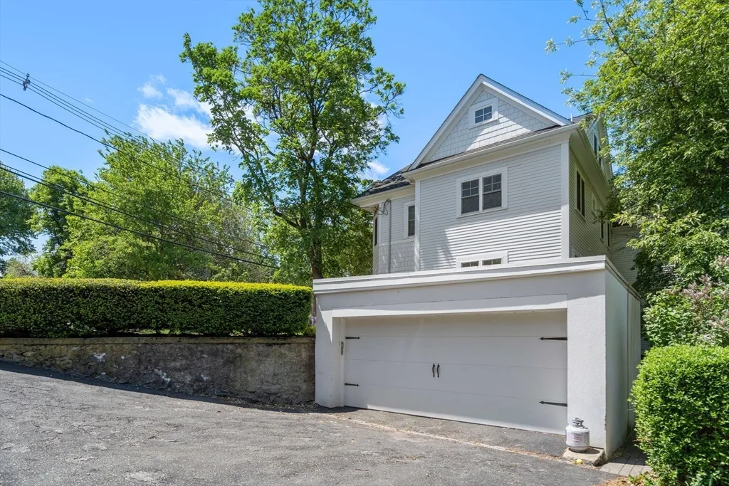 a picture of a room with a white wall and white cabinets